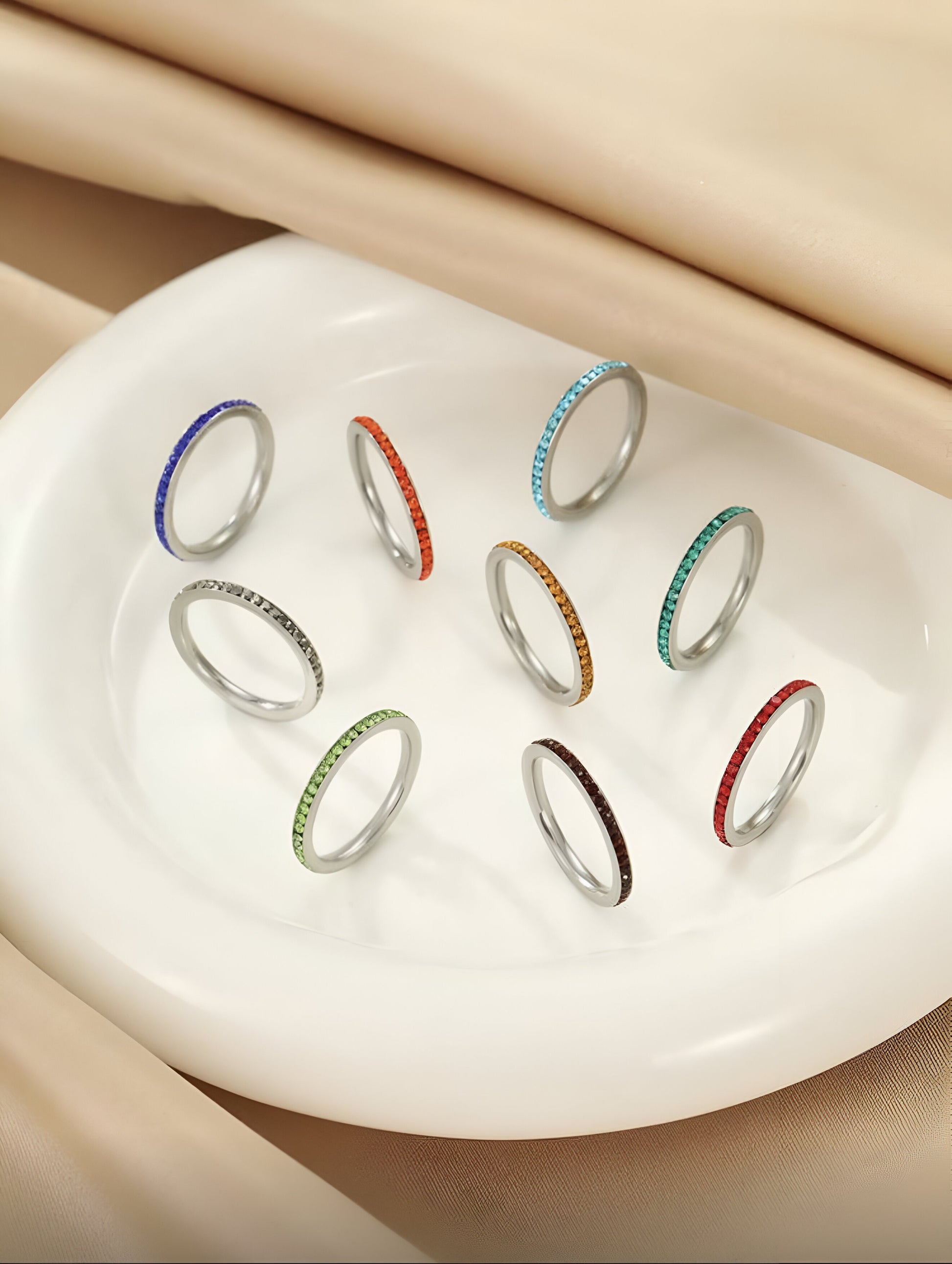 colorful crystal stacking rings in a 9-piece set, minimalist rainbow jewelry, elegant feminine accessory
