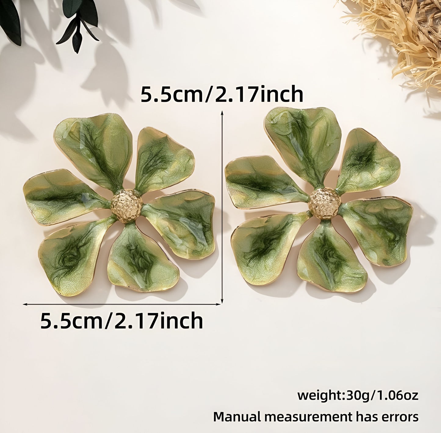 Oversized green flower earrings with glossy enamel finish.