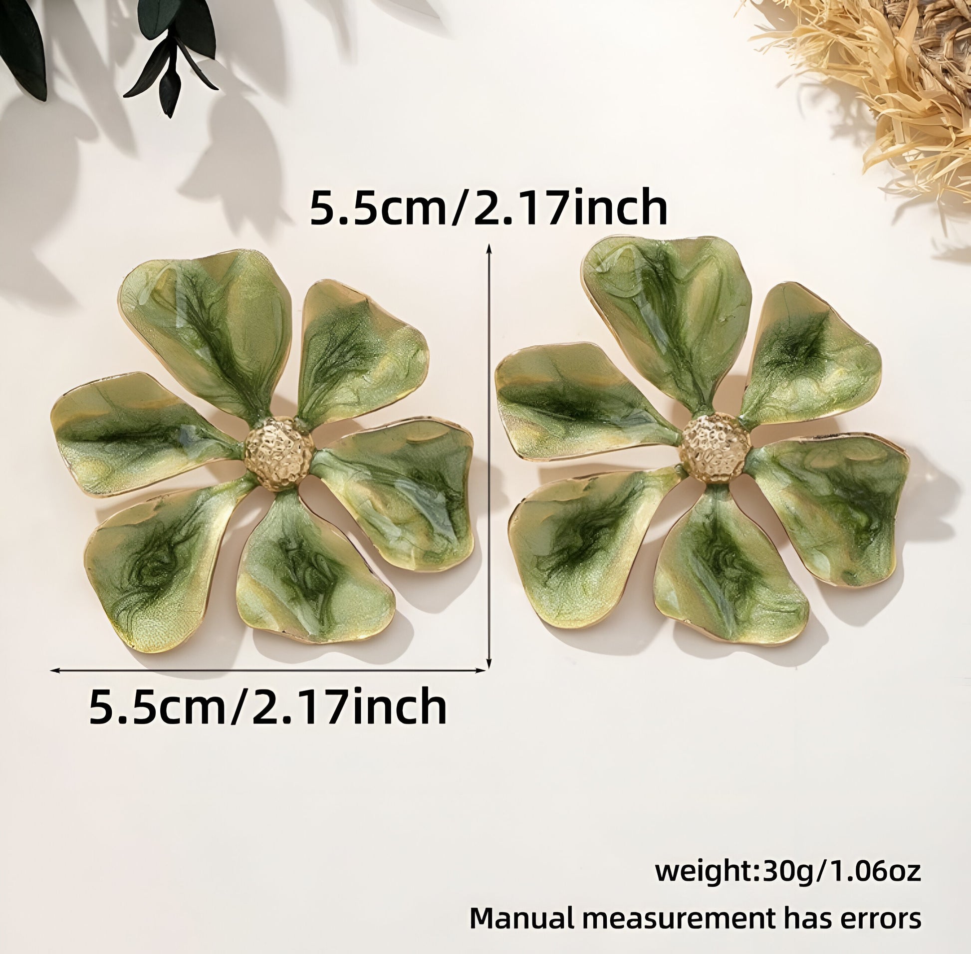 Oversized green flower earrings with glossy enamel finish.